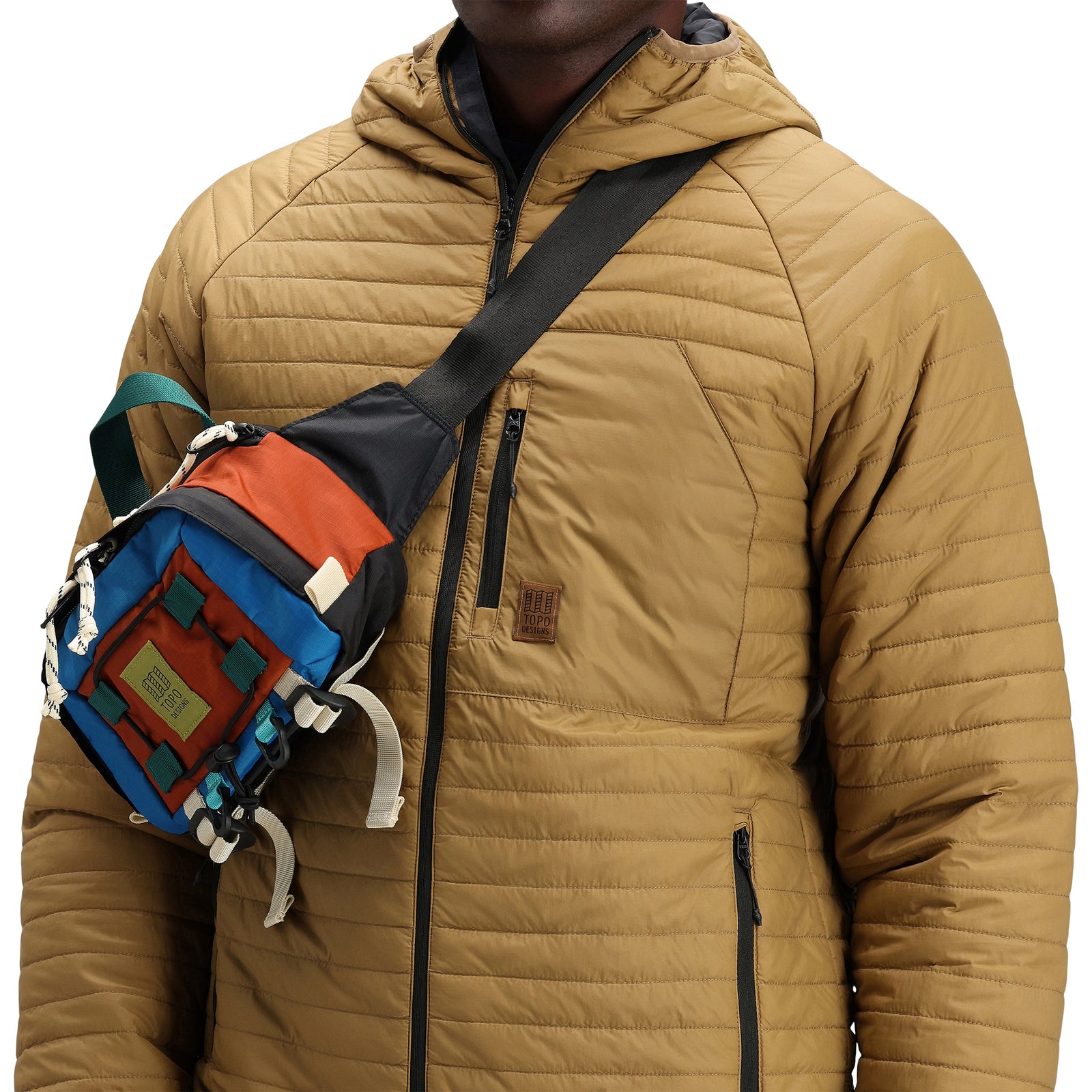 Front model shot of Topo Designs Men's Global Puffer packable recycled insulated Hoodie jacket in "dark khaki" brown