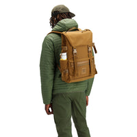 General back model shot of the Topo Designs Rover Pack Tech external access laptop backpack in "Dark Khaki".