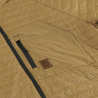 Detail shot of chest zipper pocket on Topo Designs Men's Global Puffer packable recycled insulated Hoodie jacket in "dark khaki" brown
