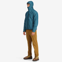 Side model shot of Topo Designs Men's Global Puffer packable recycled insulated Hoodie jacket in "pond blue". 