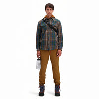 General front model shot of Topo Designs Men's Boulder lightweight climbing & hiking pants in "dark khaki" brown. 