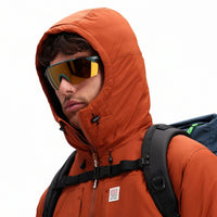 General detail shot of hood on Topo Designs Mountain Puffer Primaloft insulated Hoodie jacket in "Brick" orange