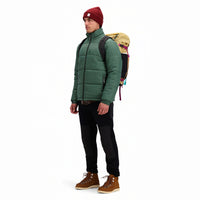 Front model shot of Topo Designs Men's Puffer recycled insulated Jacket in "Forest" green.