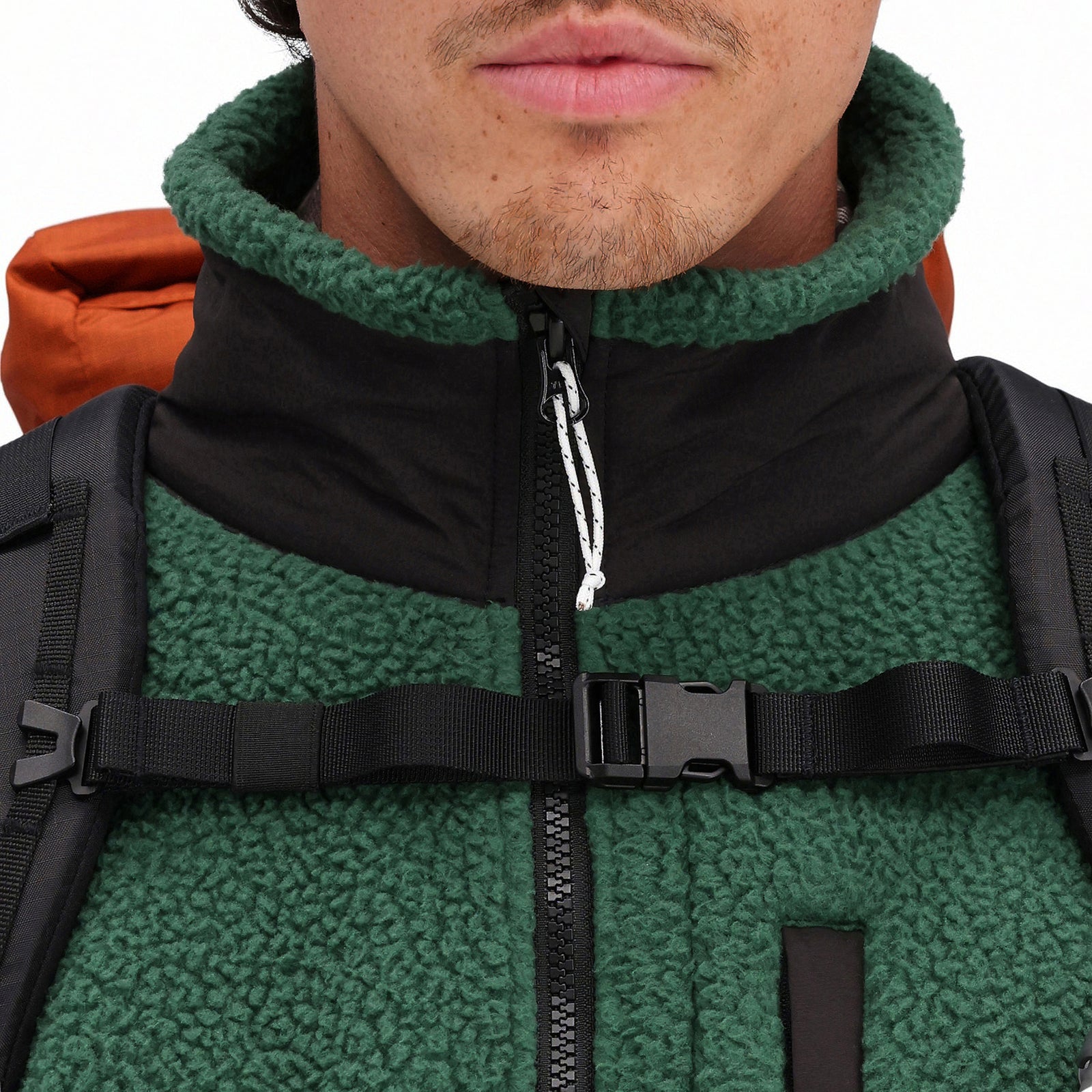 General front model detail shot of zipper and collar on Topo Designs Men's Mountain Fleece Pullover in "Forest" green.