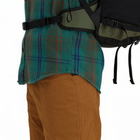 Side detail shot of Topo Designs Men's Mountain Shirt Heavyweight "Green / Earth Plaid" brown blue button-up.
