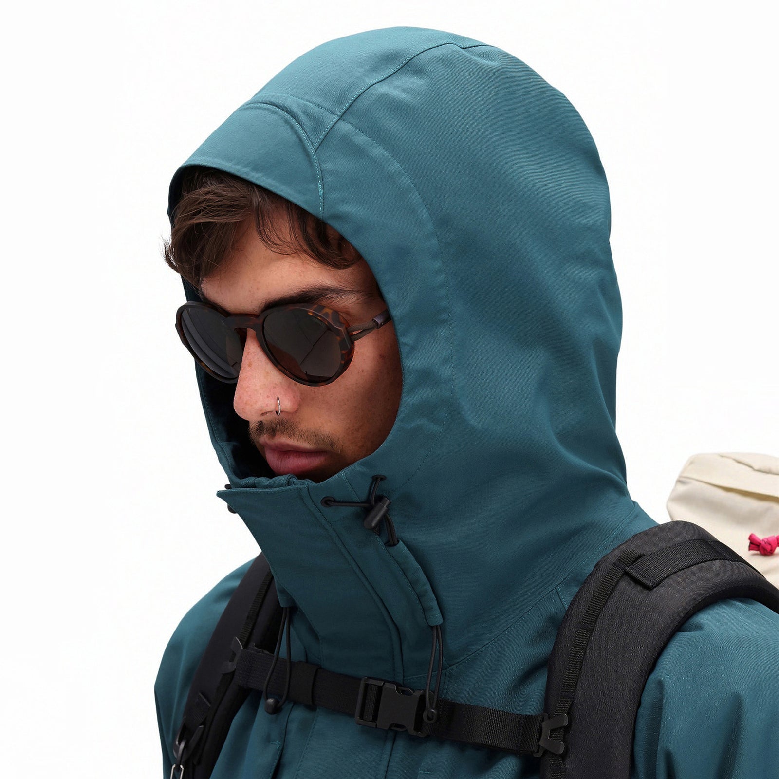 General front model shot showing hood on Topo Designs Men's Mountain Parka waterproof shell jacket in "Pond Blue"