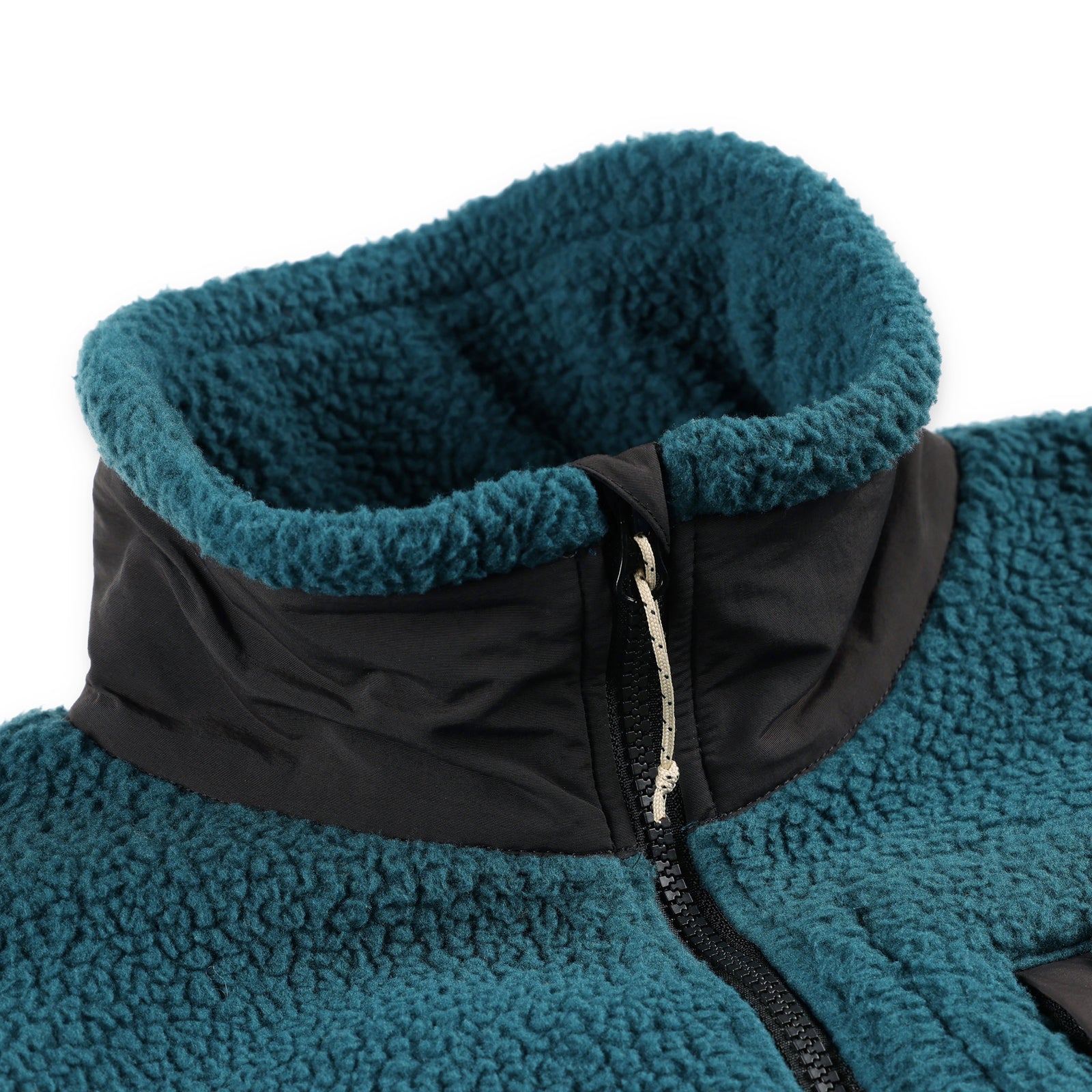 General detail shot of the collar and zipper on Topo Designs Men's Mountain Fleece Pullover in "Pond Blue".