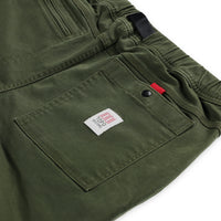 General detail shot of back snap pocket on Topo Designs Men's Mountain Pants in organic cotton "olive" green