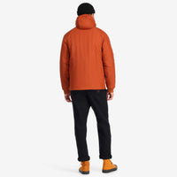 Back model shot of Topo Designs Mountain Puffer Primaloft insulated Hoodie jacket in "Brick" orange