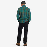Back model shot of Topo Designs Men's Mountain Shirt Heavyweight "Green / Earth Plaid" brown blue button-up.