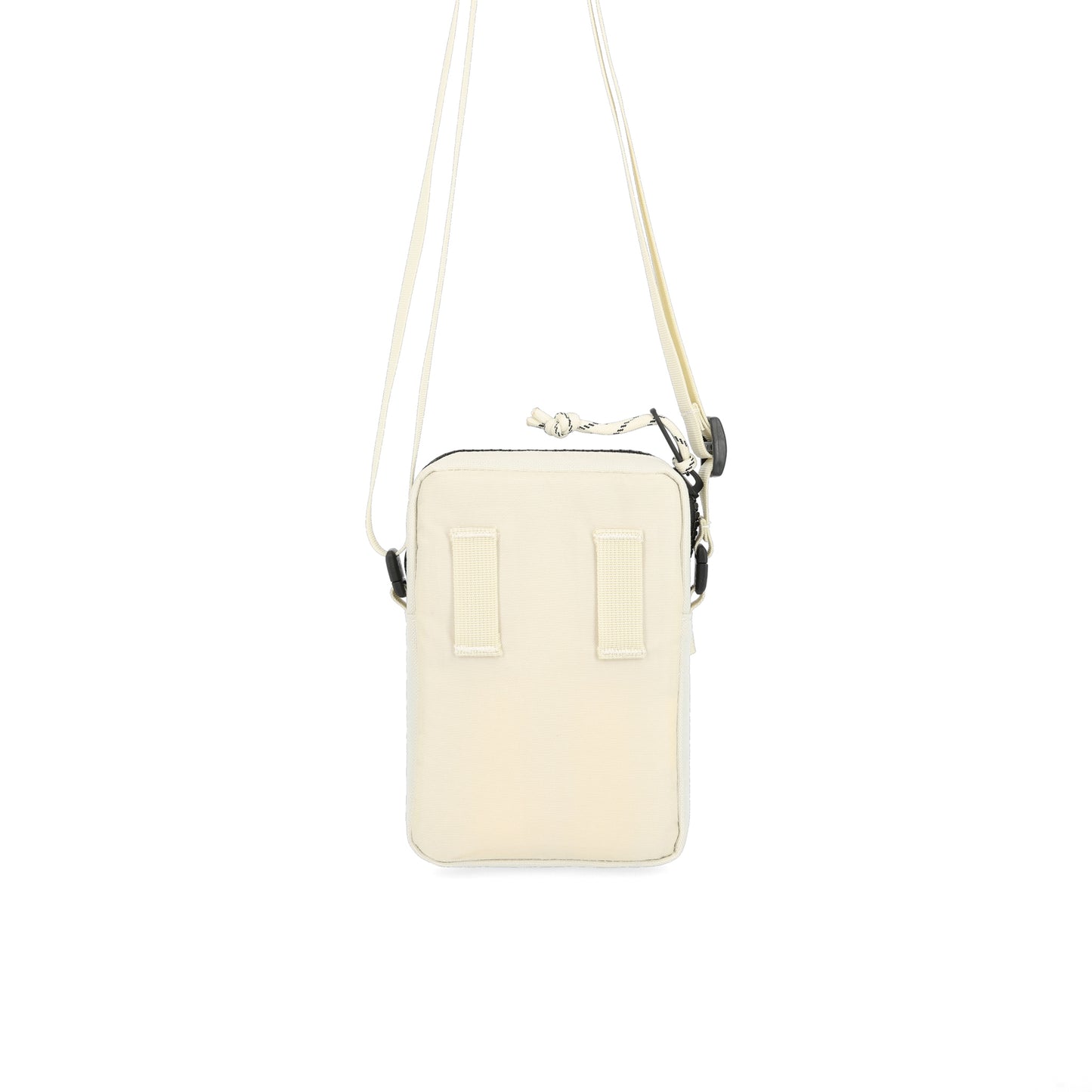 Back hip belt attachment points on Topo Designs Mini Shoulder Bag crossbody travel purse in "Bone White" recycled nylon.