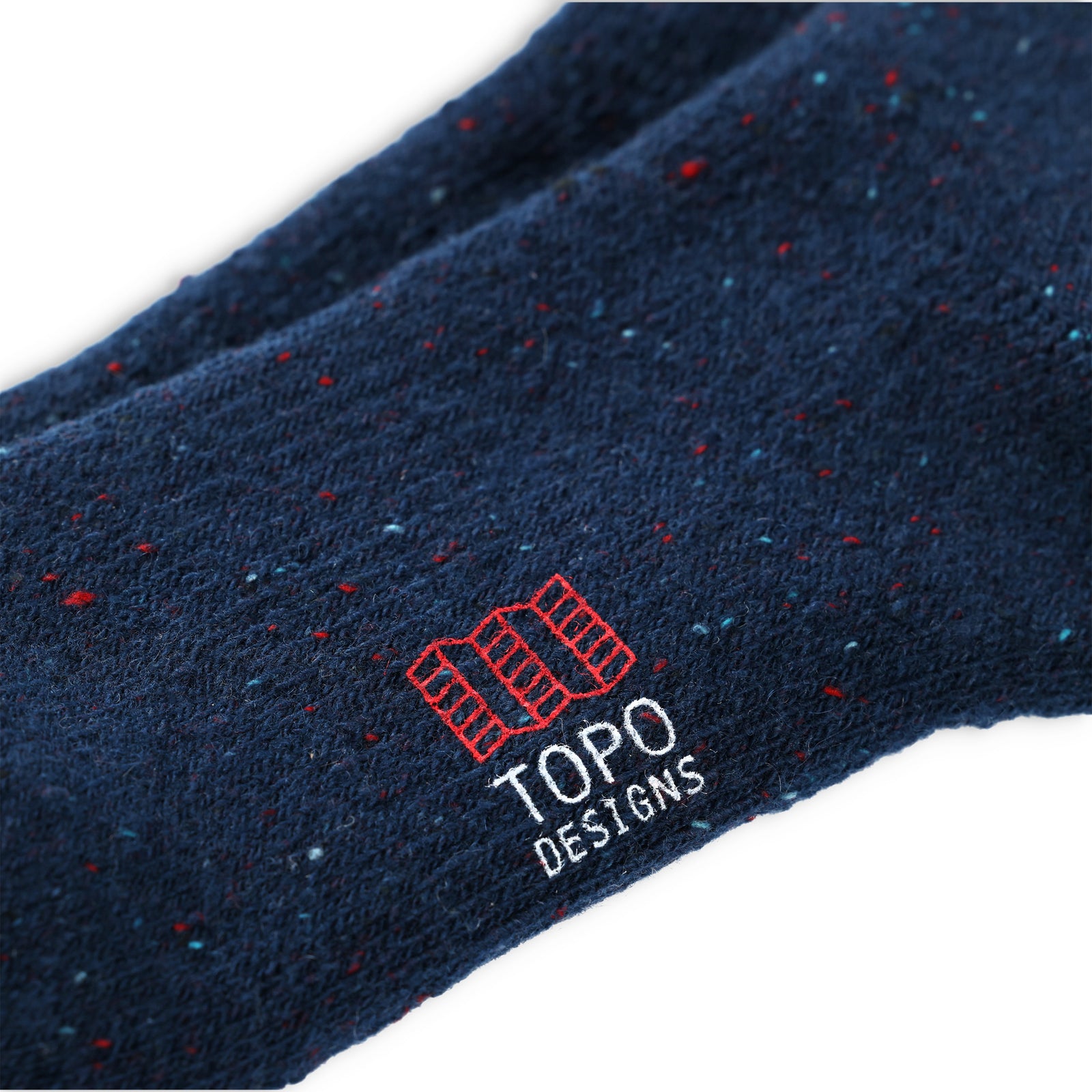 General detail shot of logo on Topo Designs Mountain heavyweight wool blend hiking Socks in "Pond Blue"