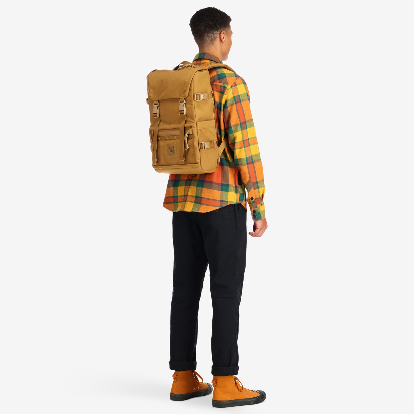 Back model shot of the Topo Designs Rover Pack Tech external access laptop backpack in "Dark Khaki"