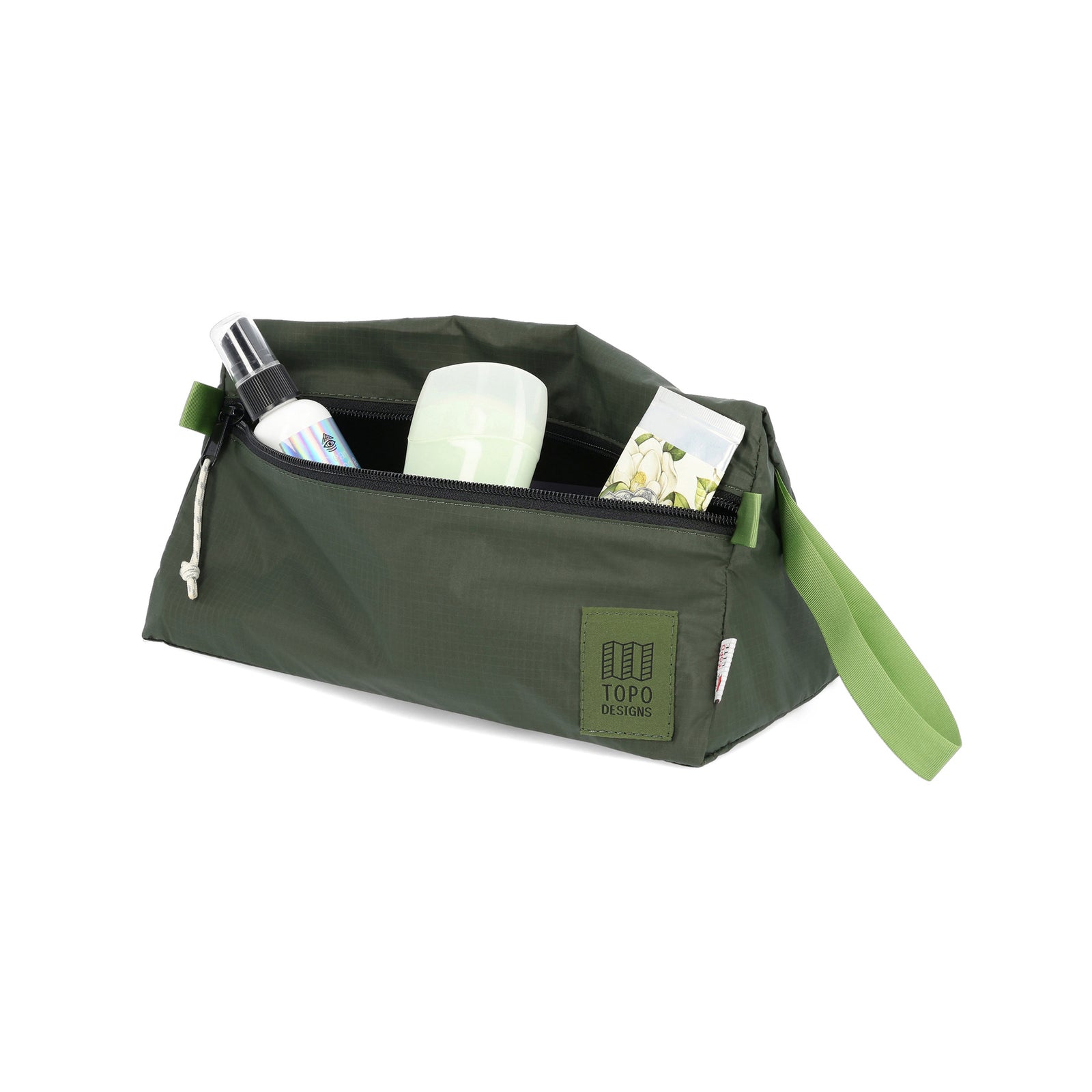 General shot of toiletries inside of Topo Designs TopoLite Dopp Kit ultralight toiletry bag for travel in "olive" green