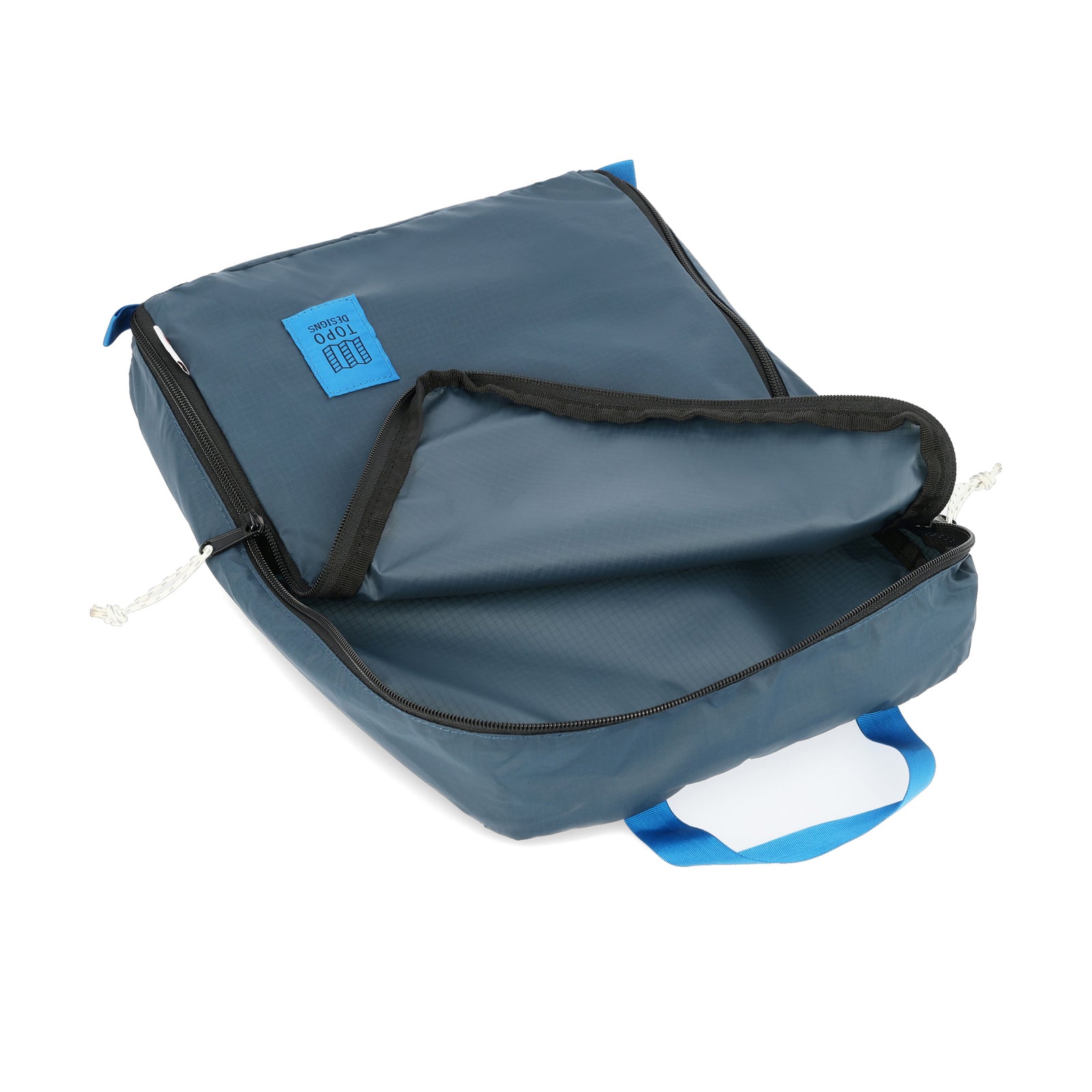 General detail shot of inside of Topo Designs TopoLite 10L Pack Bag ultralight packing cube for travel in "pond blue"
