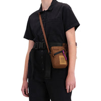 Front model shot of Topo Designs Women's Dirt Coverall 100% organic cotton short sleeve jumpsuit in "black"