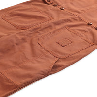 General detail shot of back pockets on Topo Designs Women's Dirt Coverall 100% organic cotton short sleeve jumpsuit in "brick" orange