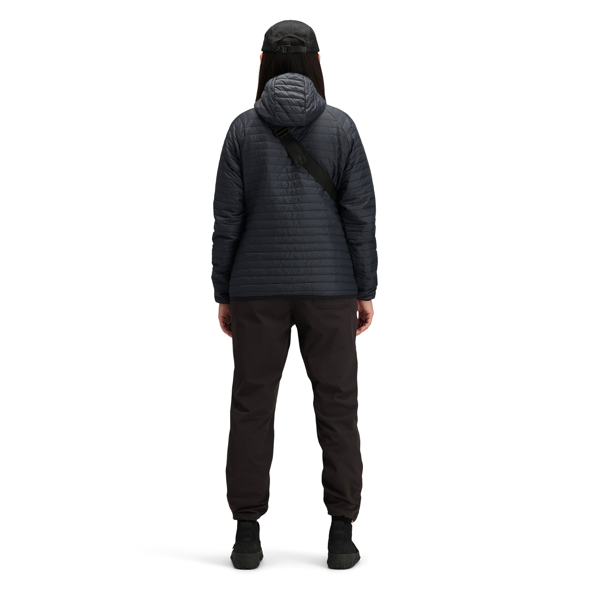 Back model shot of Topo Designs Women's Global Puffer recycled insulated packable Hoodie jacket in "black"