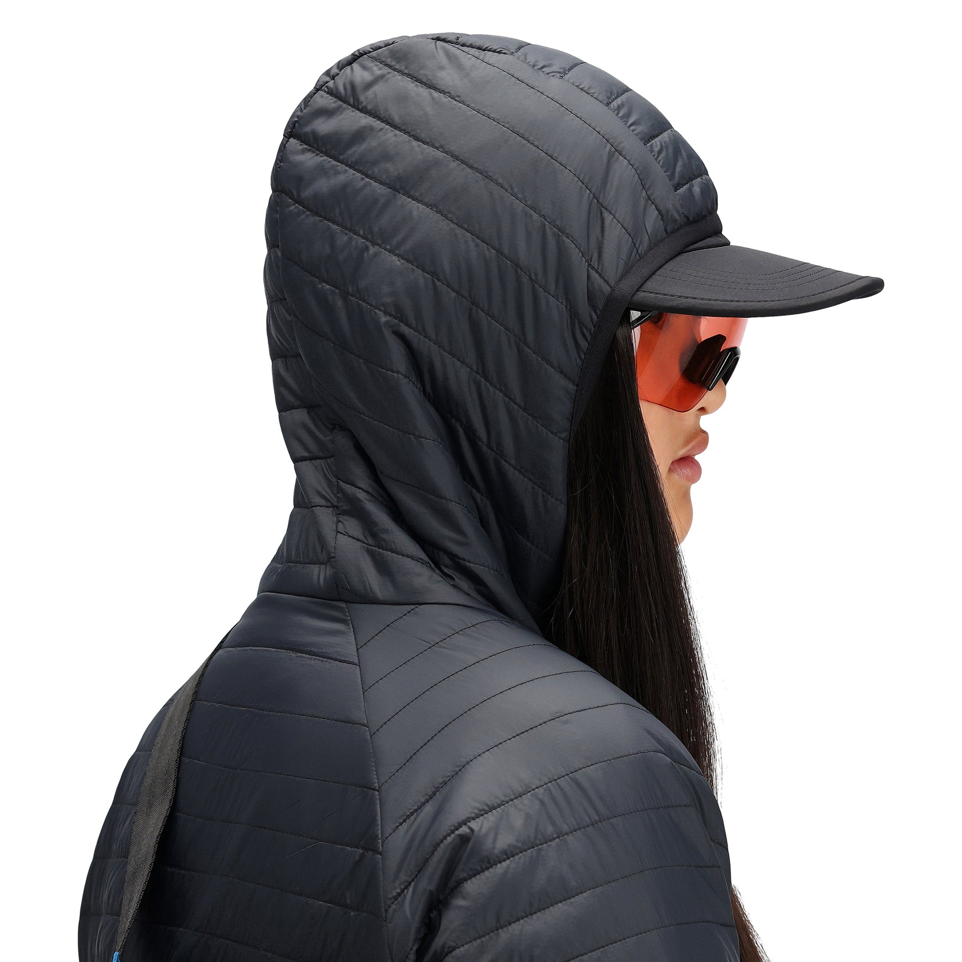 General detail shot of hood on Topo Designs Women's Global Puffer recycled insulated packable Hoodie jacket in "black"