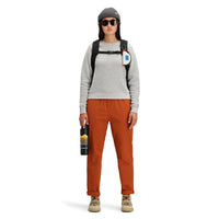 Front model shot of Topo Designs women's boulder pants in "brick" orange