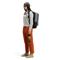 Side model shot of Topo Designs women's boulder pants in "brick" orange