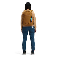Back model shot of Topo Designs women's boulder lightweight hiking and climbing pants in "pond blue". 