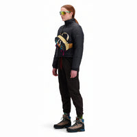 Side model shot of Topo Designs Women's Puffer recycled insulated Jacket in "Black"