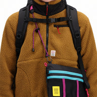 General front detail shot of collar and zipper on Topo Designs Women's Mountain Fleece Pullover in "dark khaki" brown on model.