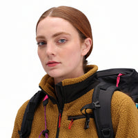 General front detail shot of collar and zipper on Topo Designs Women's Mountain Fleece Pullover in "dark khaki" brown on model.