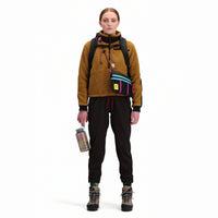 Front of Topo Designs Women's Mountain Fleece Pullover in "dark khaki" brown on model.