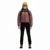 Front model shot of Topo Designs Women's Puffer recycled insulated Jacket in "Peppercorn" purple brown.