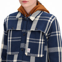 Detail model shot of Topo Designs Women's Mountain Shirt Jacket in "navy / white plaid" showing chest pockets and buttons.