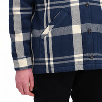 Detail model shot of Topo Designs Women's Mountain Shirt Jacket in "navy / white plaid" showing hand pockets and cuff.