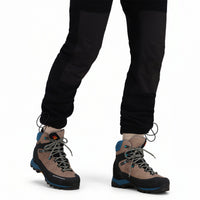 General front model shot of Topo Designs Women's Fleece Pants in "Black" showing knee panels and cinch cord at ankles.