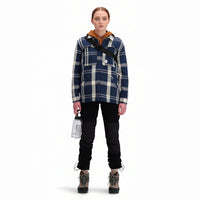 Front model shot of Topo Designs Women's Mountain Shirt Jacket in "navy / white plaid"