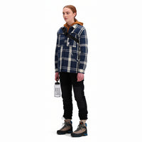 Side model shot of Topo Designs Women's Mountain Shirt Jacket in "navy / white plaid"