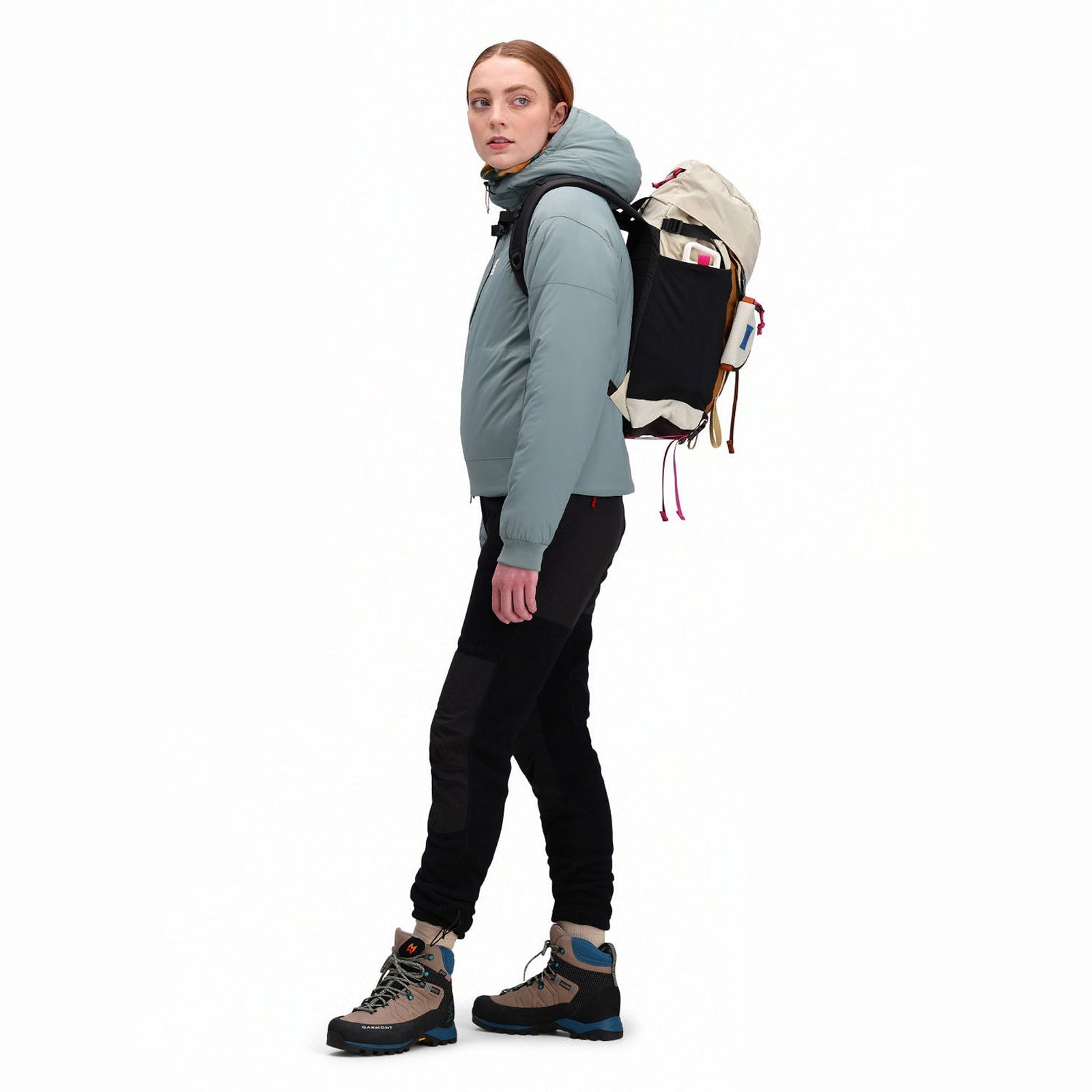 Side model shot of Topo Designs Mountain Pack 16L hiking backpack with internal laptop sleeve in lightweight recycled nylon "Bone White / Blue".