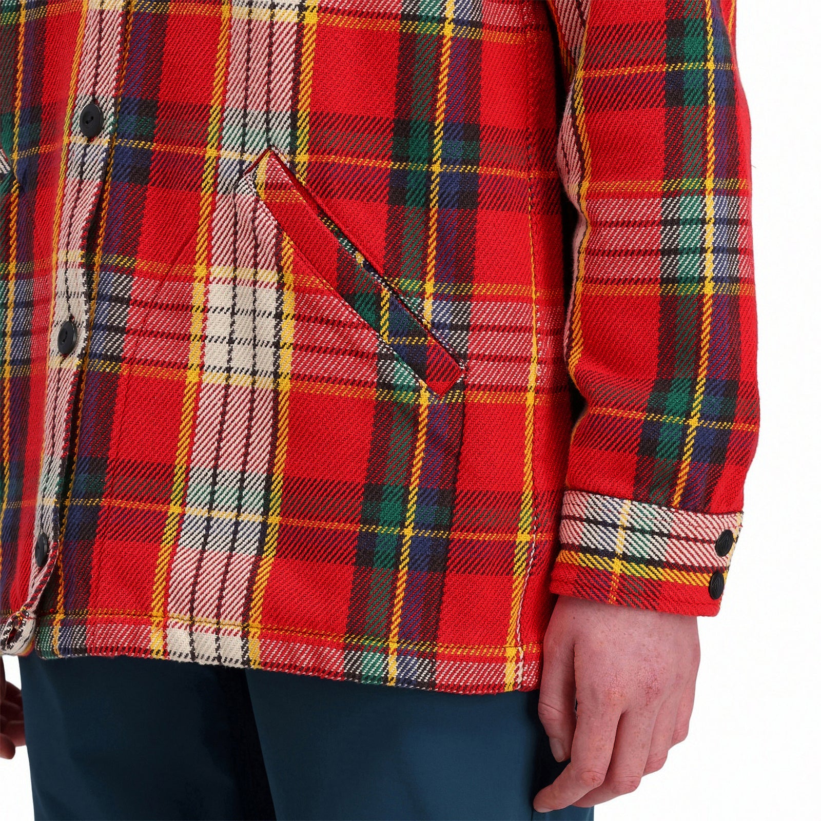 Detail model shot of Topo Designs Women's Mountain Shirt Jacket in "red / yellow plaid" showing hand pockets and sleeve cuff. Show on "brown / natural plaid"