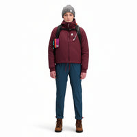 Front model shot of Topo Designs Women's Puffer Primaloft insulated Hoodie jacket in "burgundy" red.