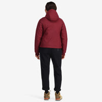 Back model shot of Topo Designs Women's Puffer Primaloft insulated Hoodie jacket in "burgundy" red.