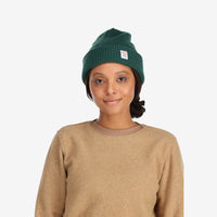 Front model shot of Topo Designs Watch Cap cuffed beanie in "forest" green.