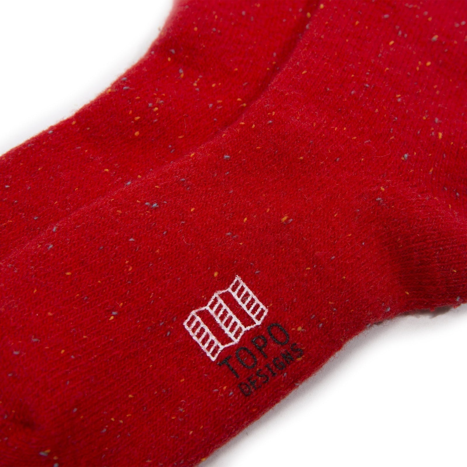 Detail of logo on Topo Designs Mountain Socks in "Red"