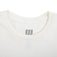 Detail product shot of Topo Designs x New Balance Graphic tee long sleeve in natural showing the neck hemline