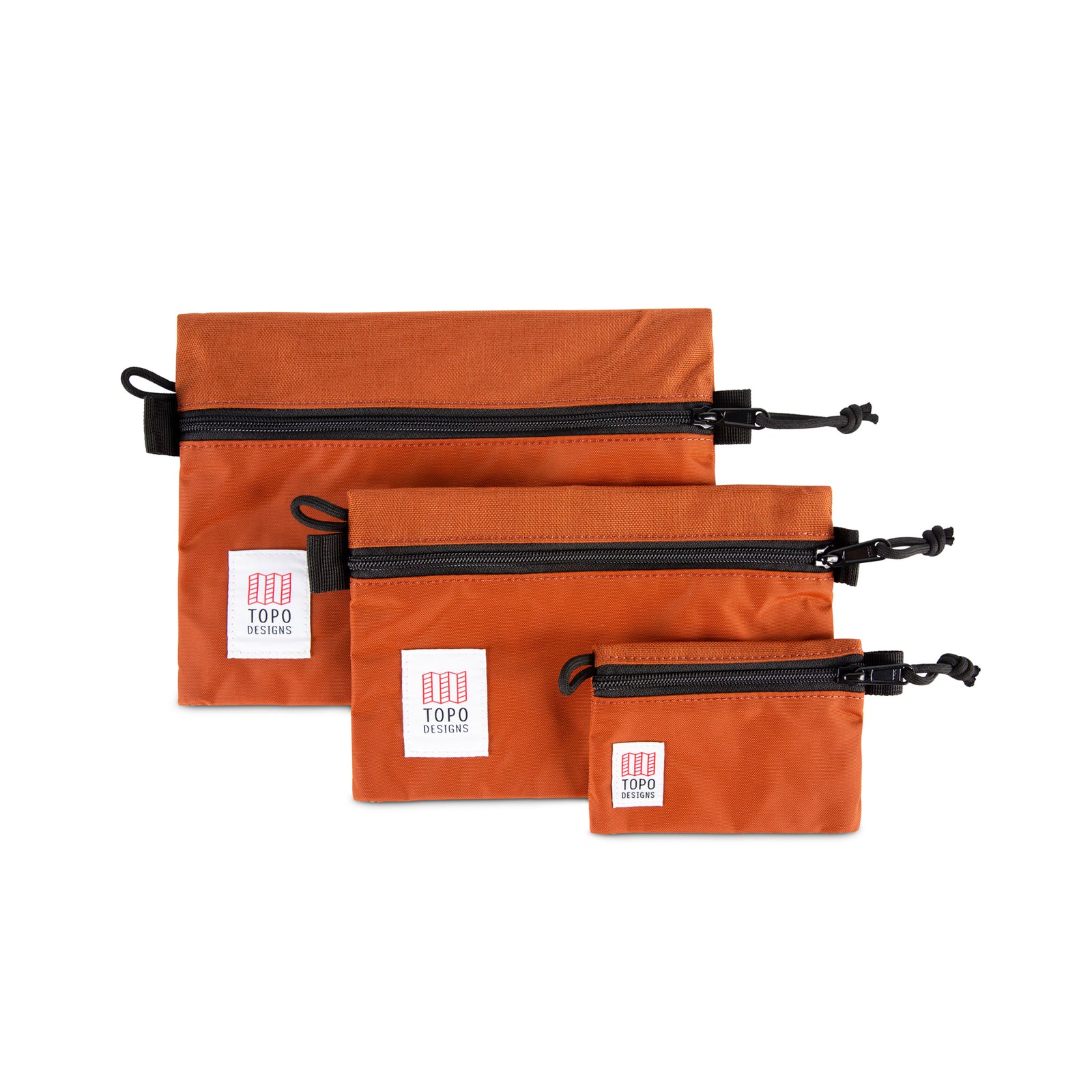 Topo Designs Accessory Bags - product shot of the "Medium", "Small", and "Micro" accessory bags in "Clay - Recycled" orange.
