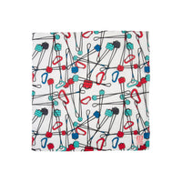 Topo Designs bandana in "Gear / Natural / Blue - Final Sale" print with carabiners and cams.