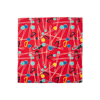 Topo Designs bandana in "Gear / Red / Blue - Final Sale" print with carabiners and cams.