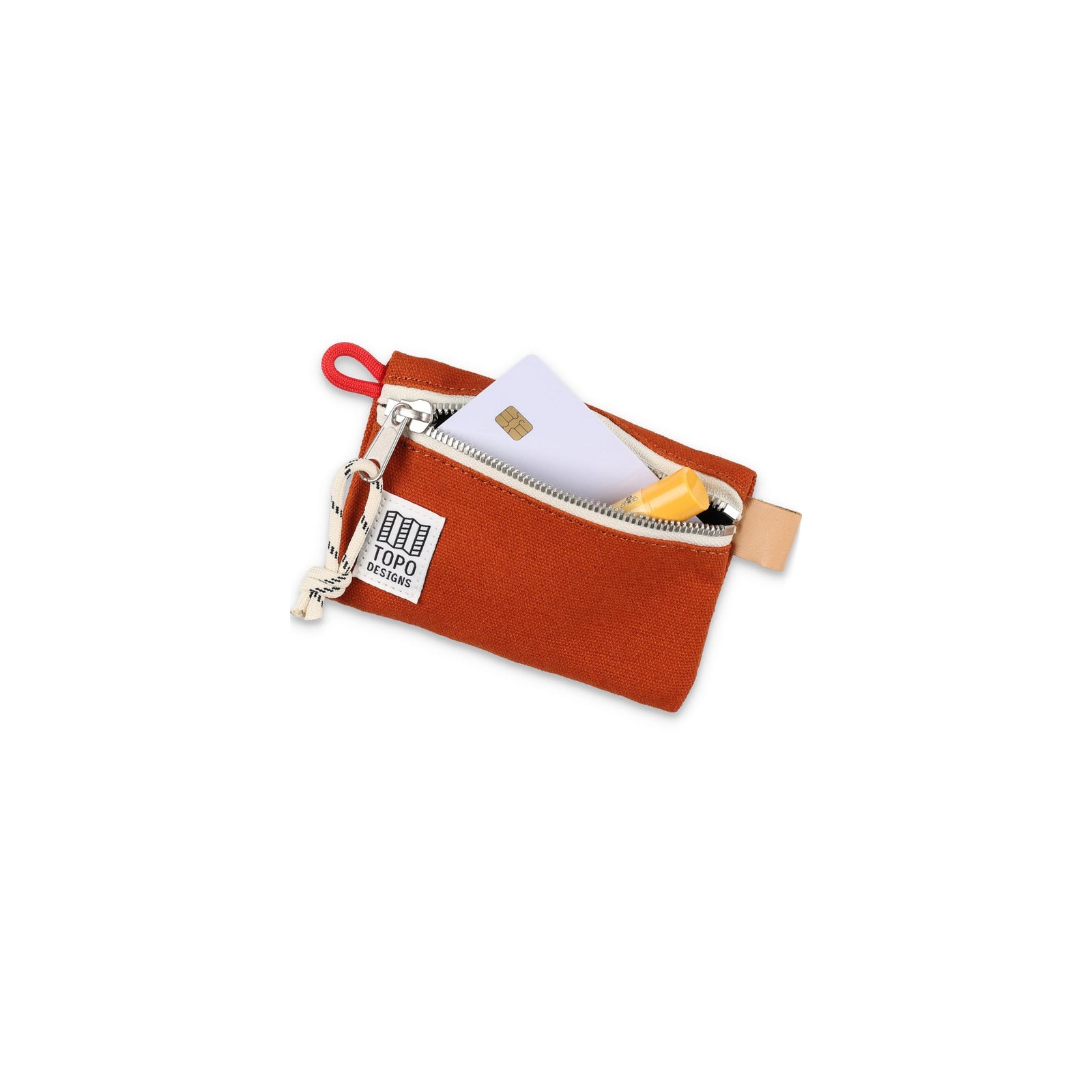 Topo Designs Accessory Bag "Micro" in "Clay" orange canvas with credit card and lip balm to show size.