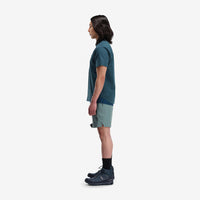 Side model shot of Topo Designs Men's Global lightweight quick dry travel Shorts in "Slate" blue gray. Show on "pond blue" and "brick".