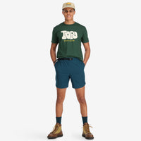 General shot of Topo Designs Men's River Shorts Lightweight quick dry swim trunks in pond blue on model.
