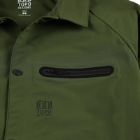 General shot of front chest zipper pocket on Topo Designs Men's Tech Breaker Jacket 4-way stretch windbreaker in olive green.